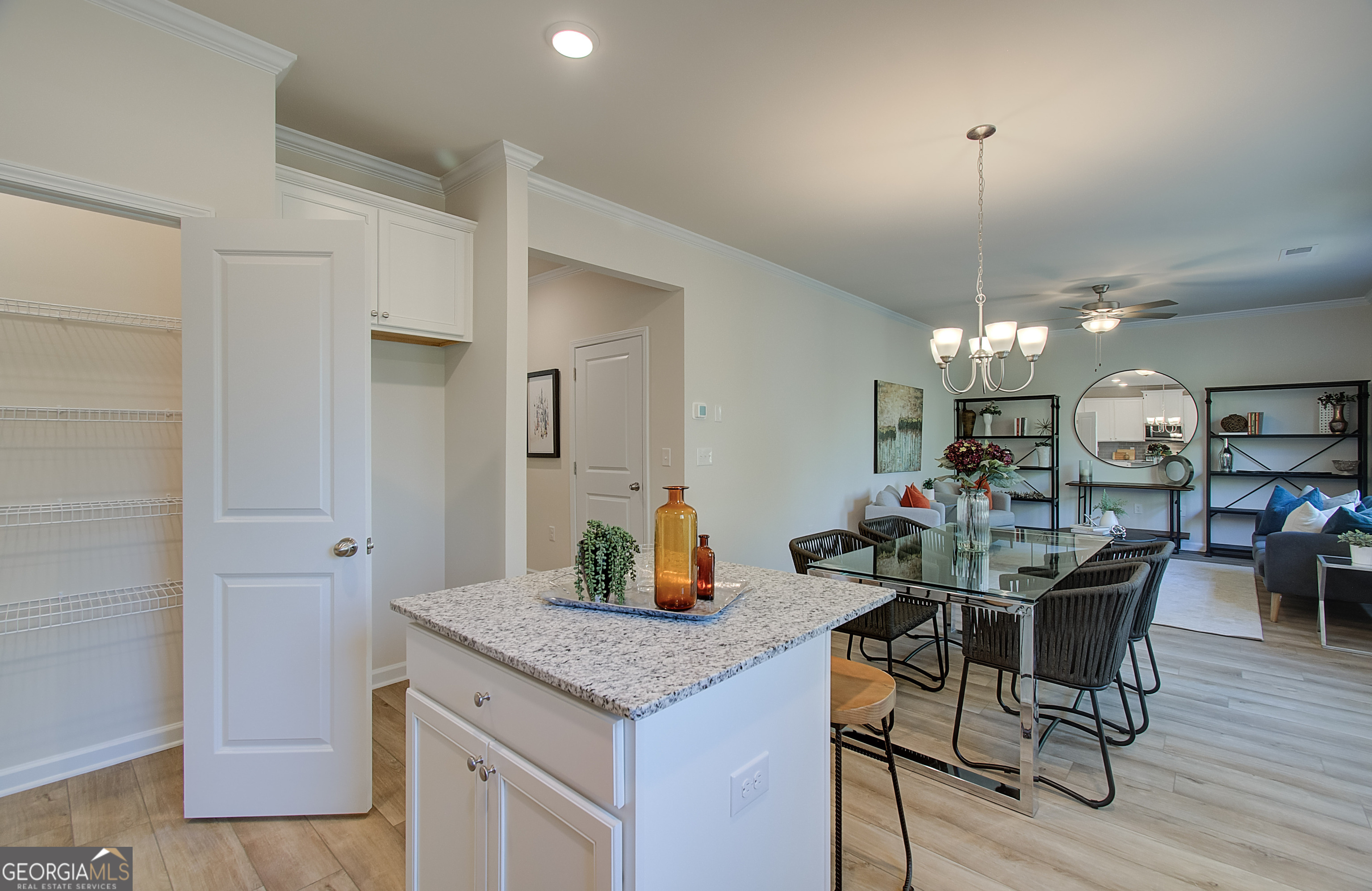 4581 Ajo Walk, Unit HOMESITE 22 Atlanta, GA 30331 - Photo 10 of 18 a kitchen with a table and chairs in it