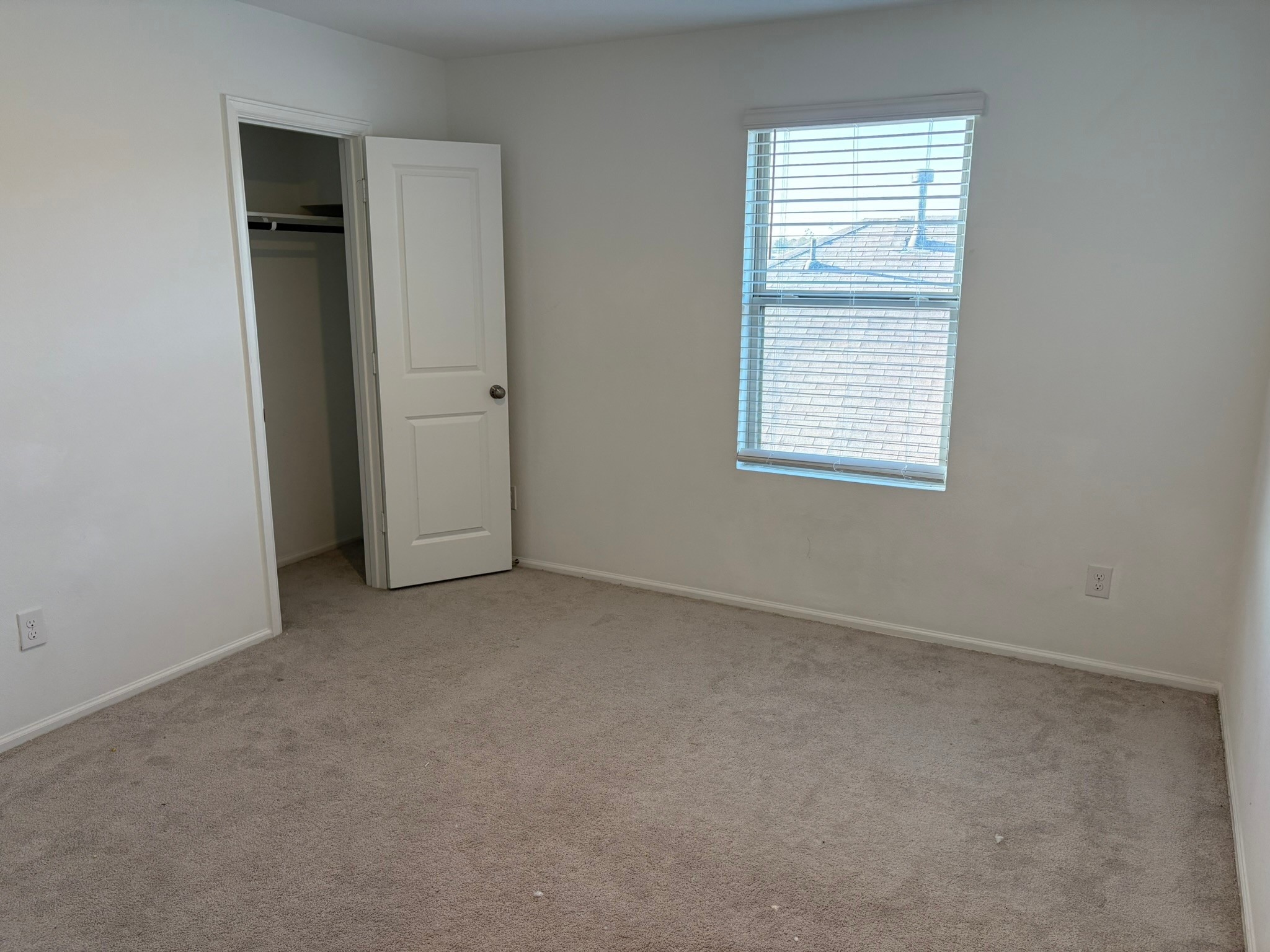 21911 Scopeto Lane New Caney, TX 77357 - Photo 12 of 14 an empty room with windows and closet