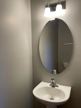 a bathroom with a sink and mirror