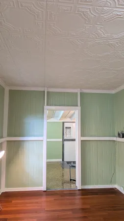 a kitchen with cabinets and window