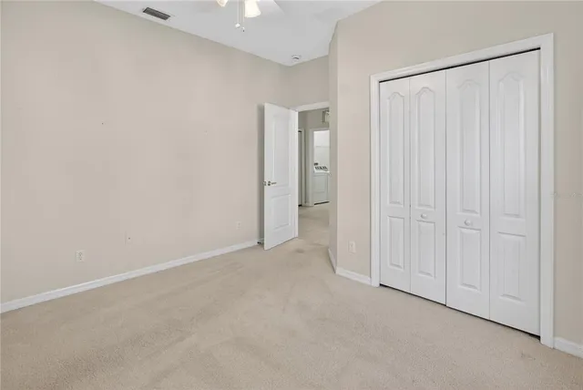 a bathroom with a bathtub shower sink vanity and toilet