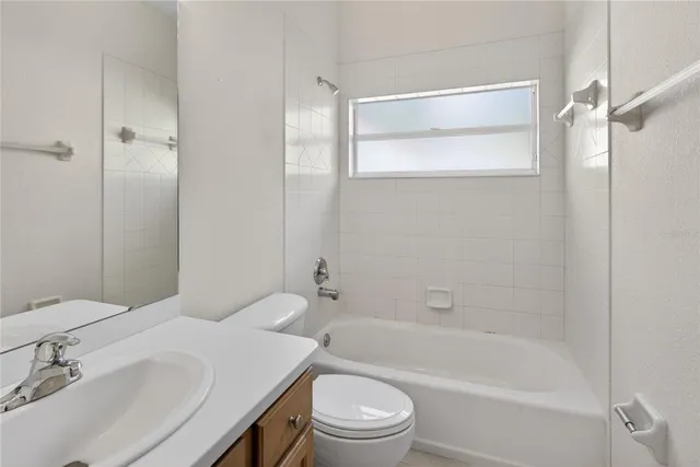 a bathroom with a bathtub and a toilet