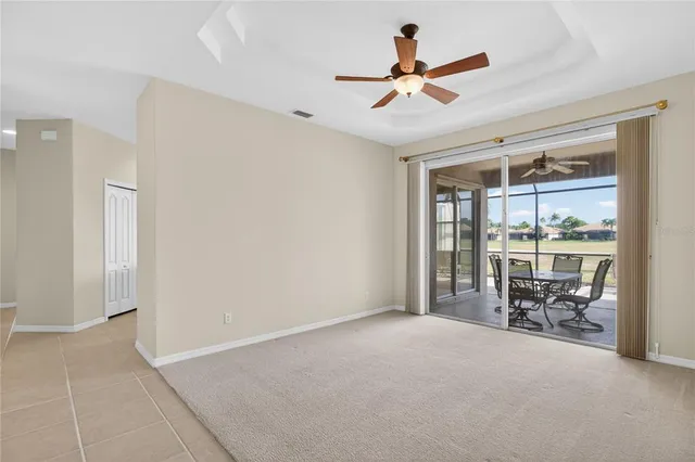a view of a livingroom with furniture and a ceiling fan