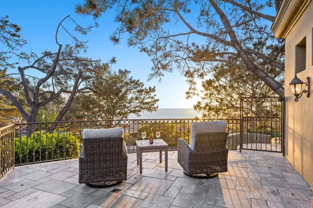 a bedroom with a bed ceiling fan and a window