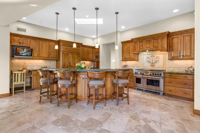 a spacious bathroom with a mirror a sink and a shower