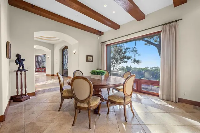 a bathroom with a large tub a sink and large window
