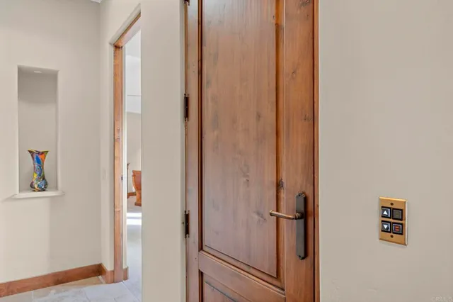 a bed sitting in a room next to a window