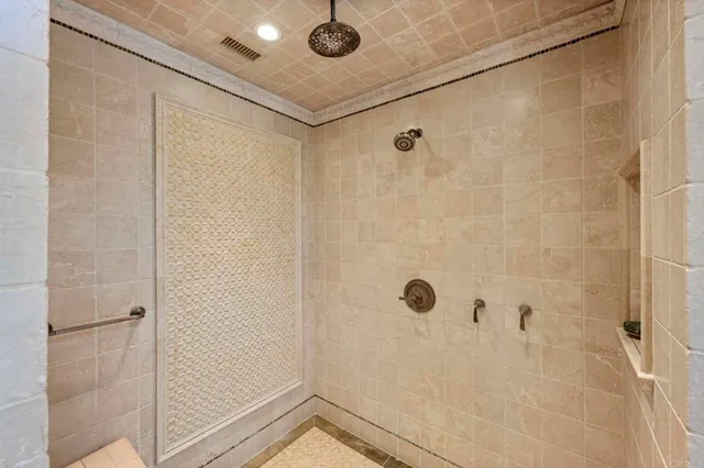 a bathroom with a shower and a sink