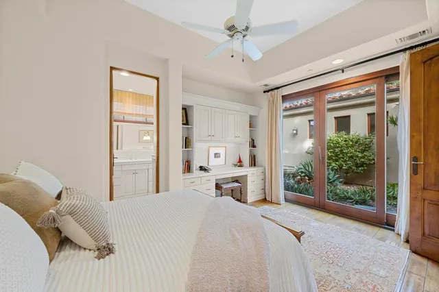 a view of a patio with table and chairs and potted plants