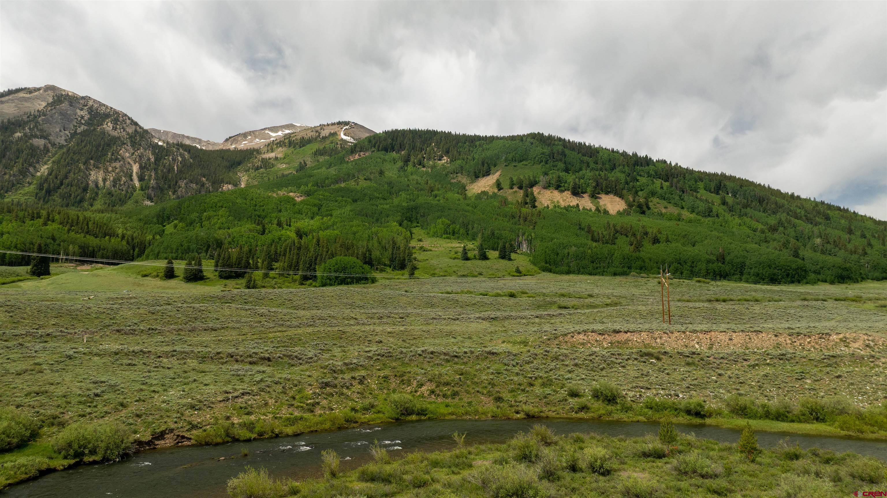 Tbd Tbd Hidden Mine Ranch Road Crested Butte, CO 81224 - Photo 11 of 19 a view of a town with mountains in the background