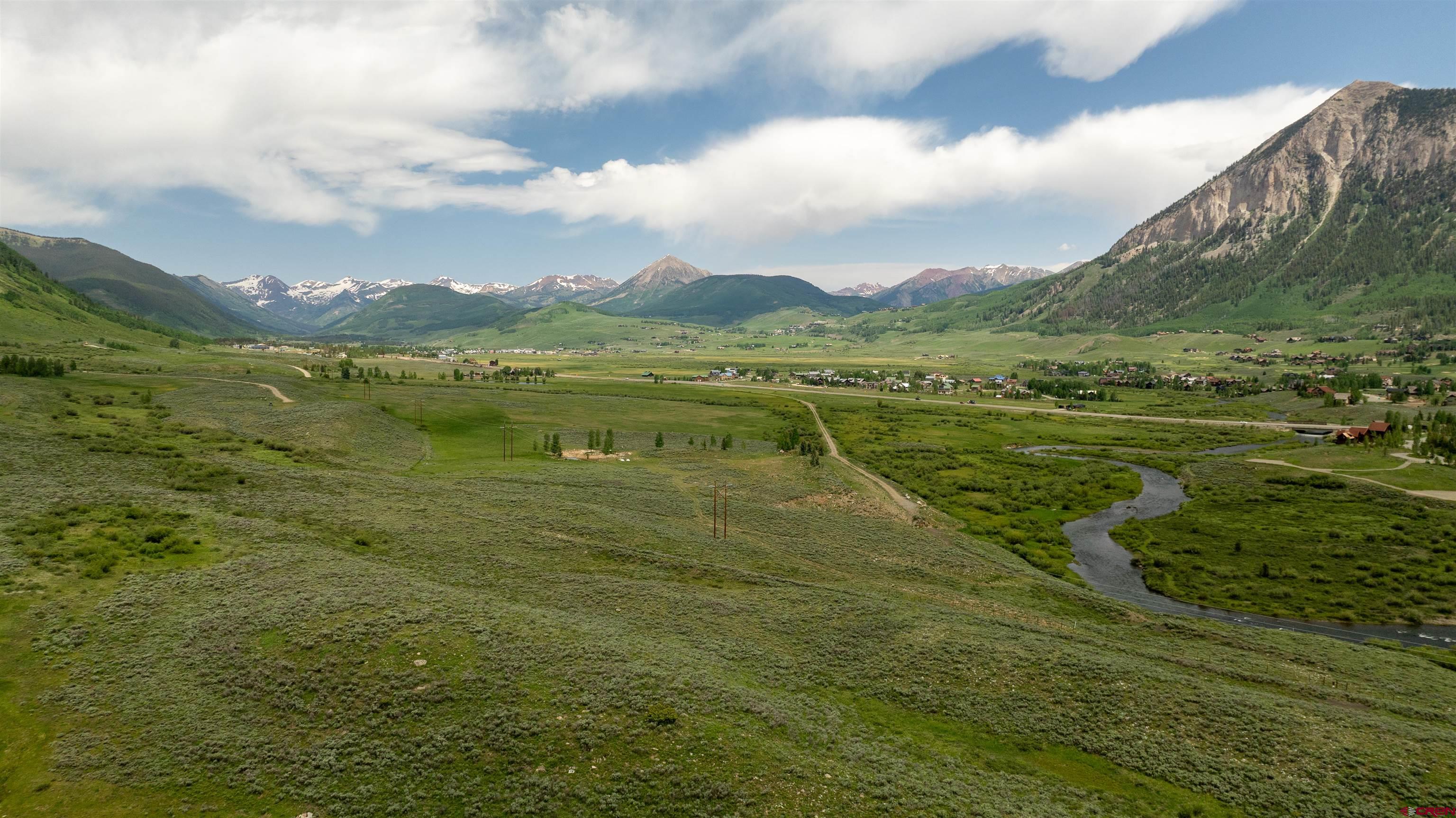 Tbd Tbd Hidden Mine Ranch Road Crested Butte, CO 81224 - Photo 14 of 19 a view of a lake with a mountain in the background
