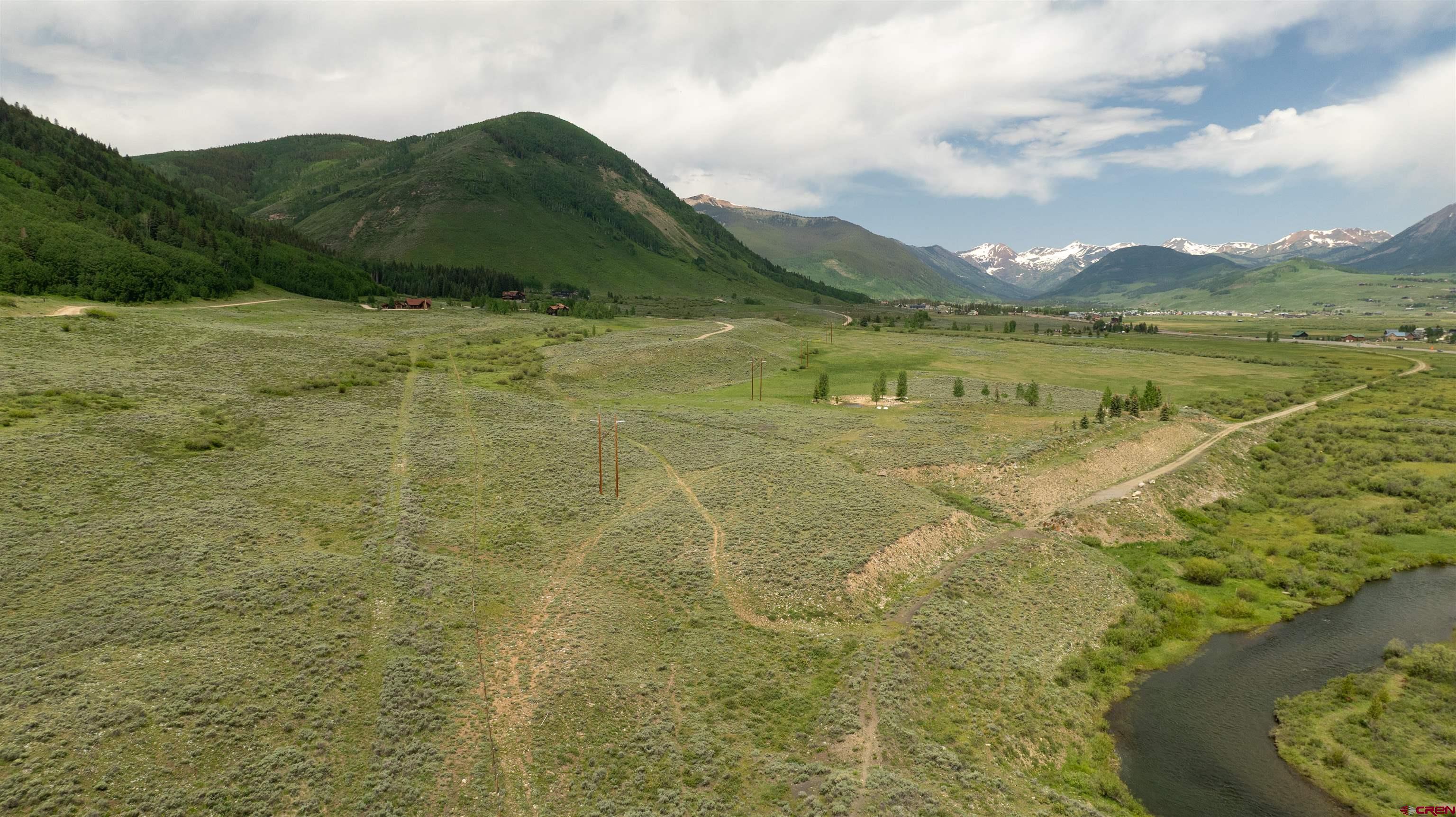 Tbd Tbd Hidden Mine Ranch Road Crested Butte, CO 81224 - Photo 6 of 19 a view of a lake with a mountain