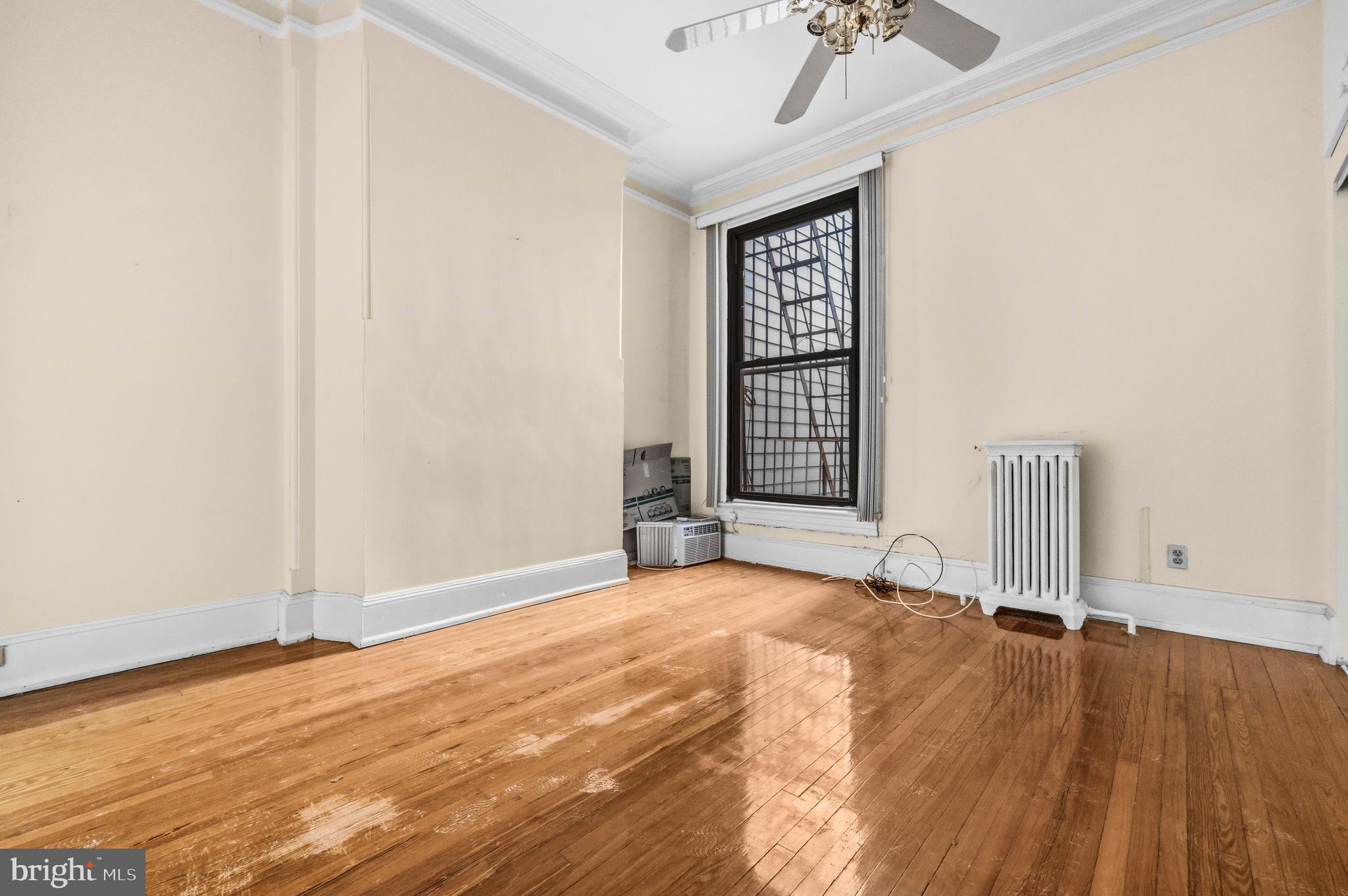 1920 11th Street Northwest Washington, DC 20001 - Photo 16 of 55 an empty room with wooden floor fan and windows