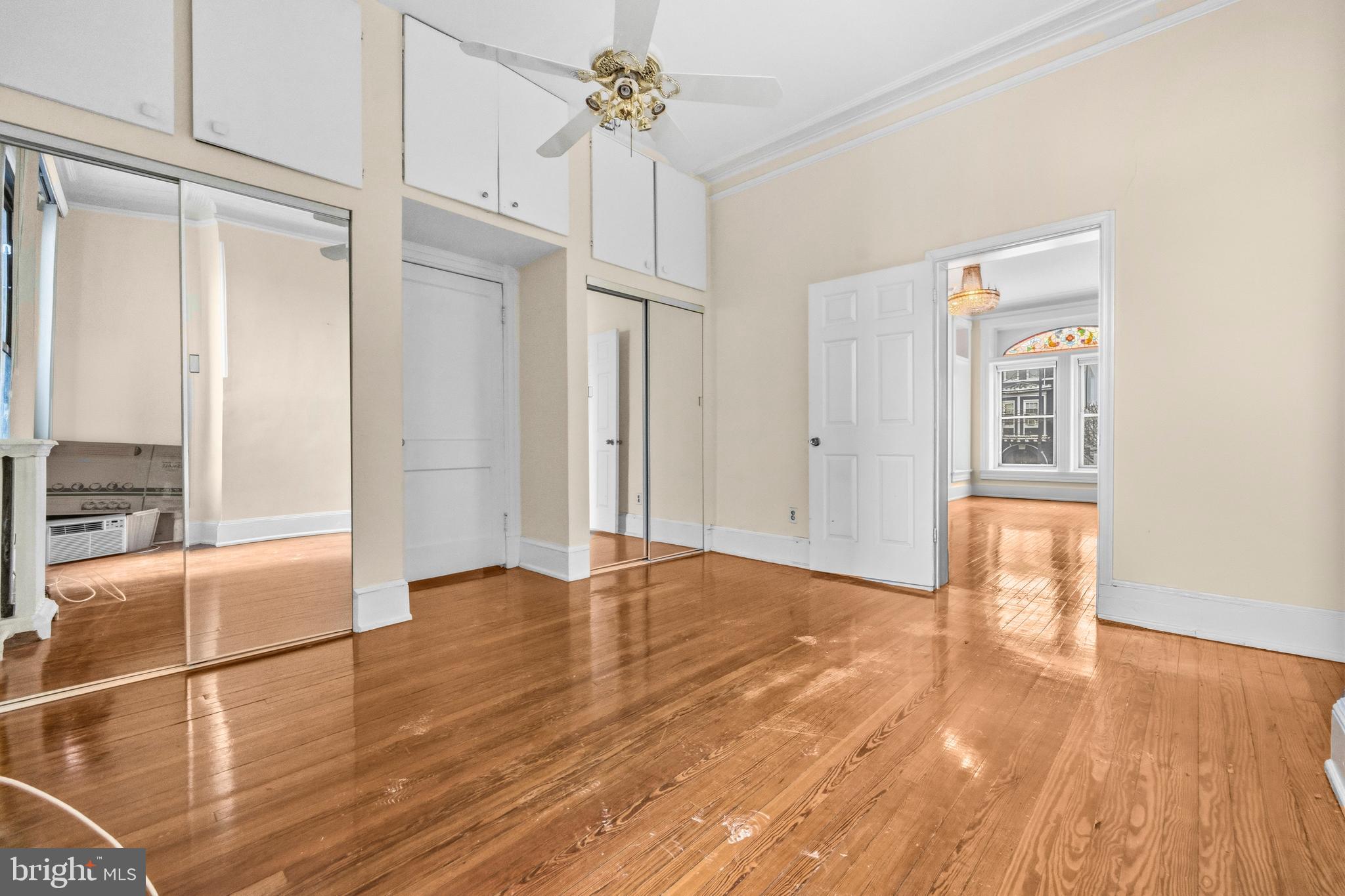 1920 11th Street Northwest Washington, DC 20001 - Photo 17 of 55 a view of an empty room with wooden floor and a window