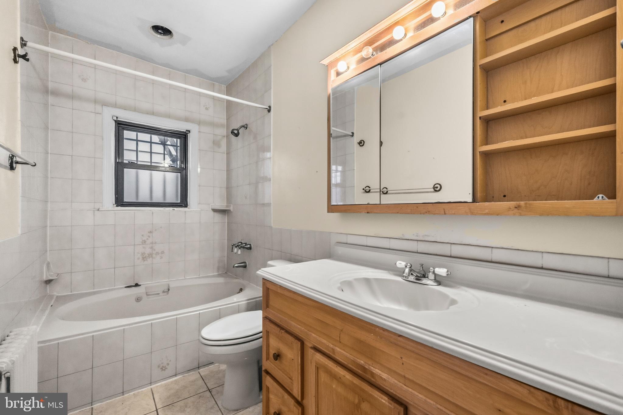 1920 11th Street Northwest Washington, DC 20001 - Photo 18 of 55 a bathroom with a sink a toilet and shower