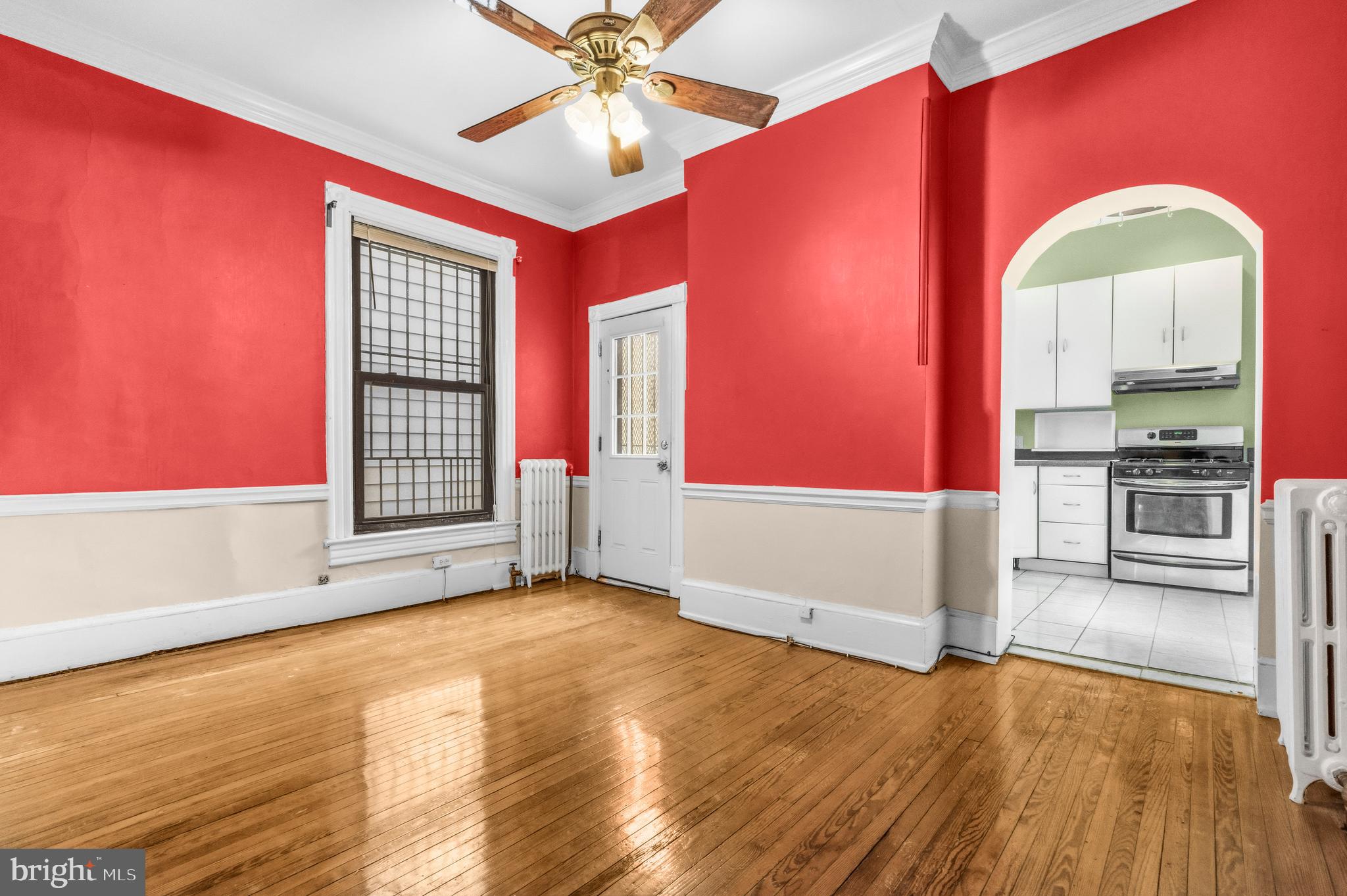 1920 11th Street Northwest Washington, DC 20001 - Photo 19 of 55 an empty room with wooden floor fan and windows
