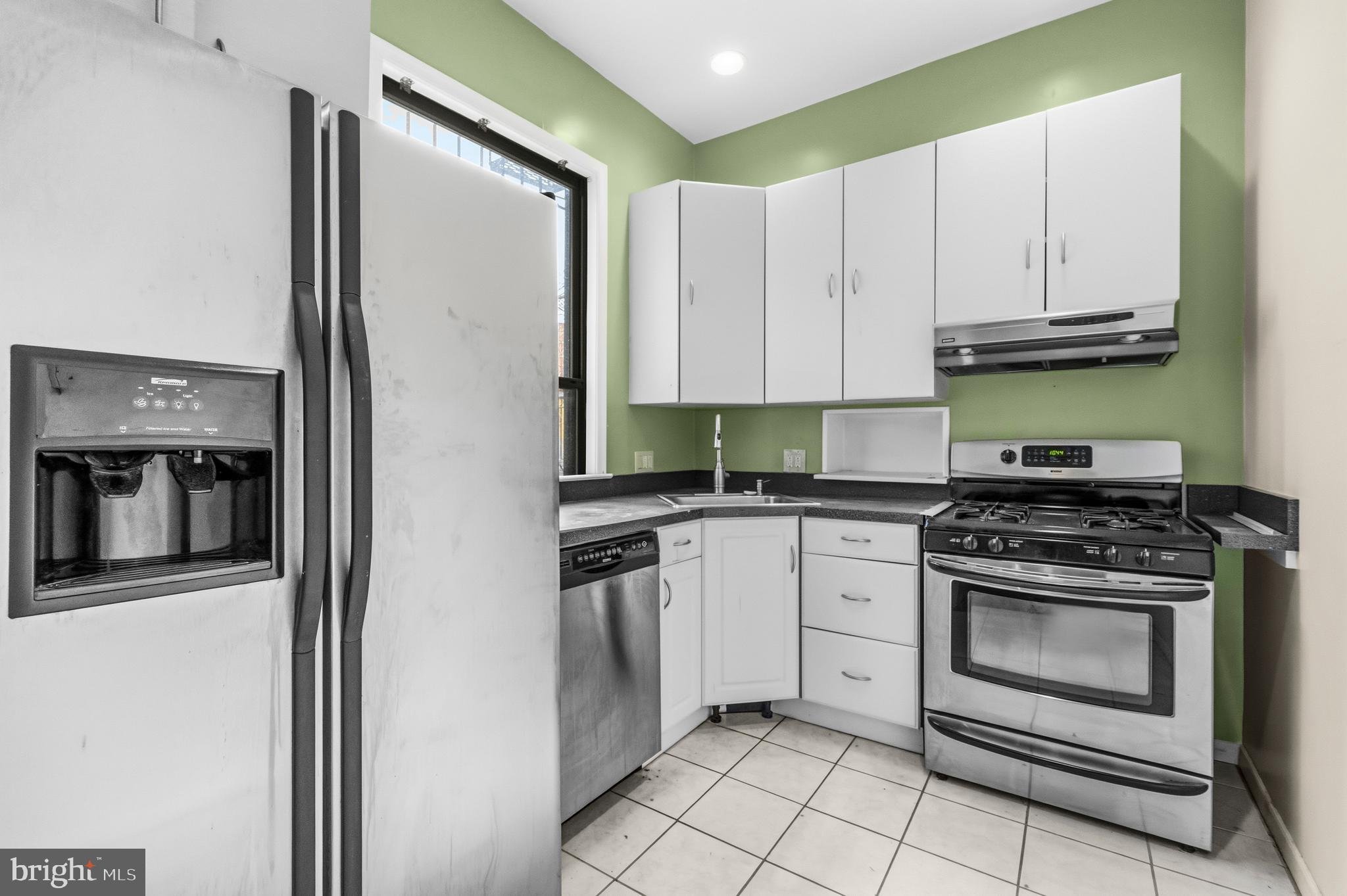 1920 11th Street Northwest Washington, DC 20001 - Photo 22 of 55 a kitchen with cabinets appliances and a sink
