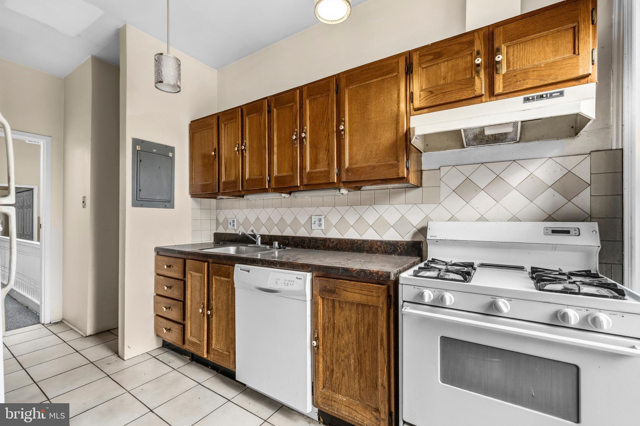1920 11th Street Northwest Washington, DC 20001 - Photo 29 of 55 a kitchen with stainless steel appliances granite countertop a stove and a sink