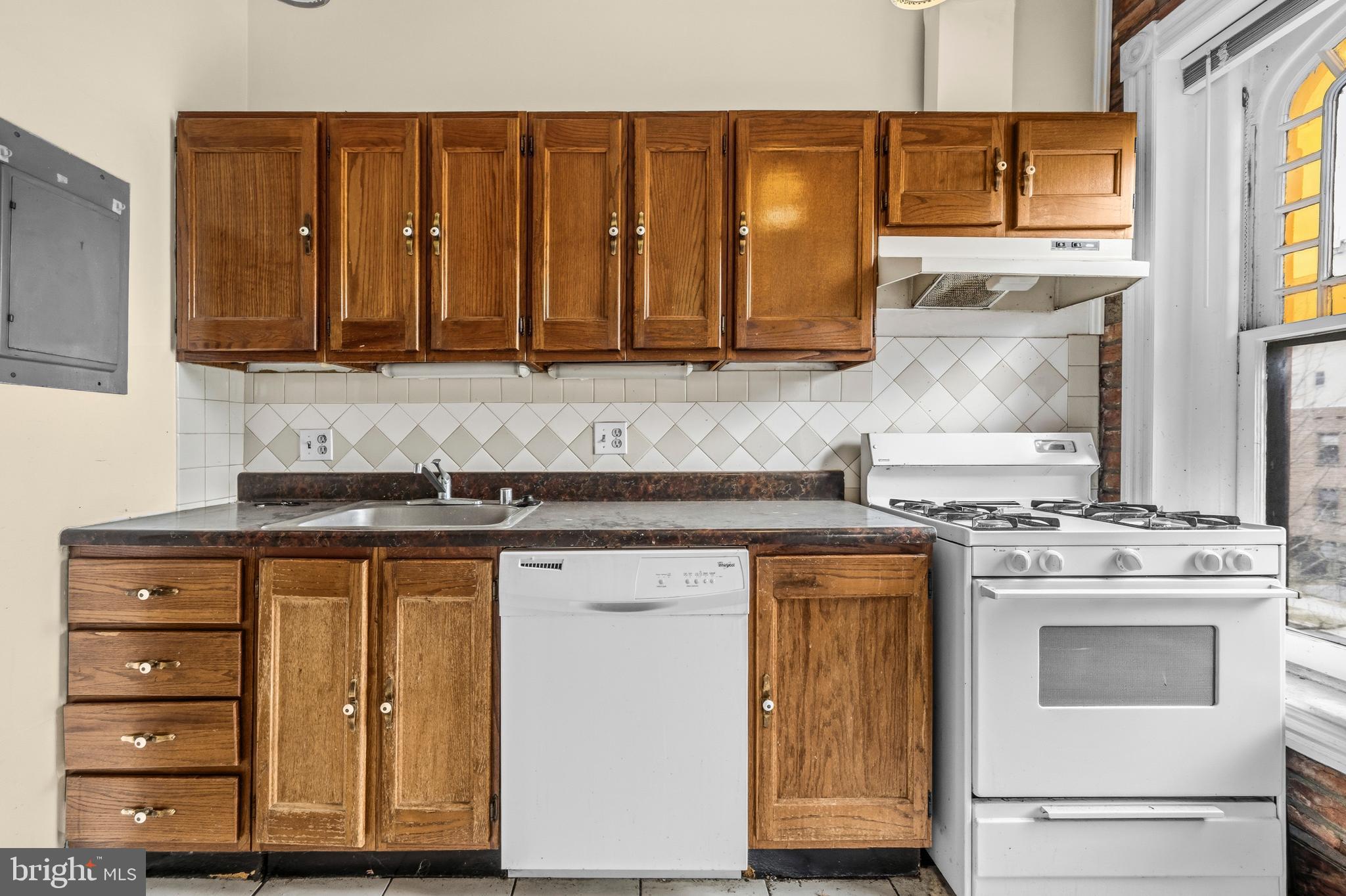 1920 11th Street Northwest Washington, DC 20001 - Photo 30 of 55 a kitchen with stainless steel appliances granite countertop a stove and a microwave