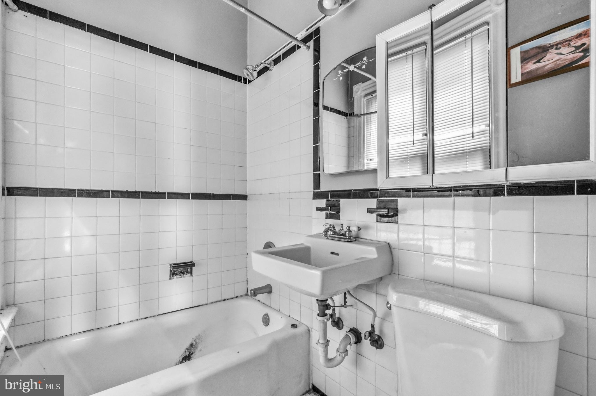 1920 11th Street Northwest Washington, DC 20001 - Photo 35 of 55 a bathroom with a sink and mirror with bathtub