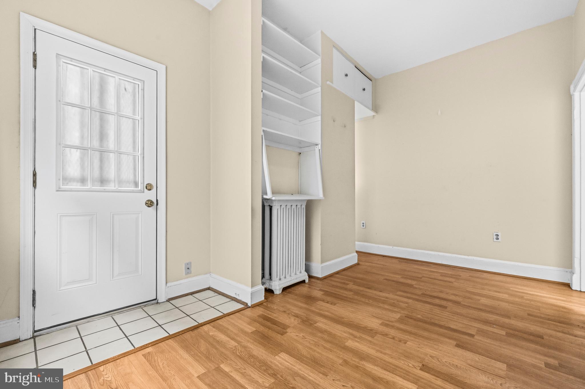 1920 11th Street Northwest Washington, DC 20001 - Photo 38 of 55 an empty room with wooden floor and a window