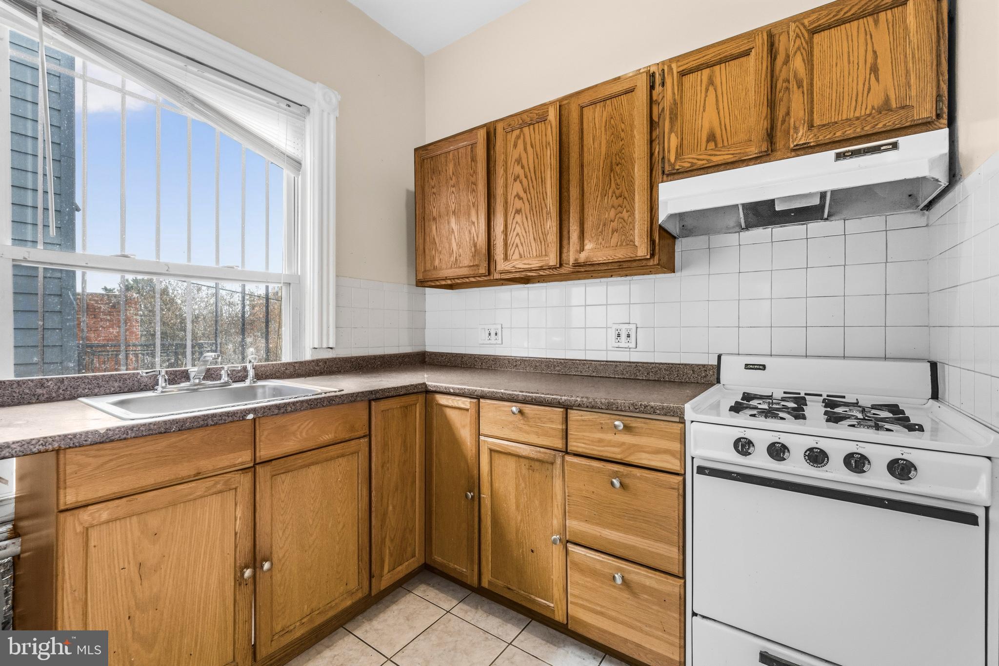 1920 11th Street Northwest Washington, DC 20001 - Photo 40 of 55 a kitchen with cabinets appliances a sink and a window
