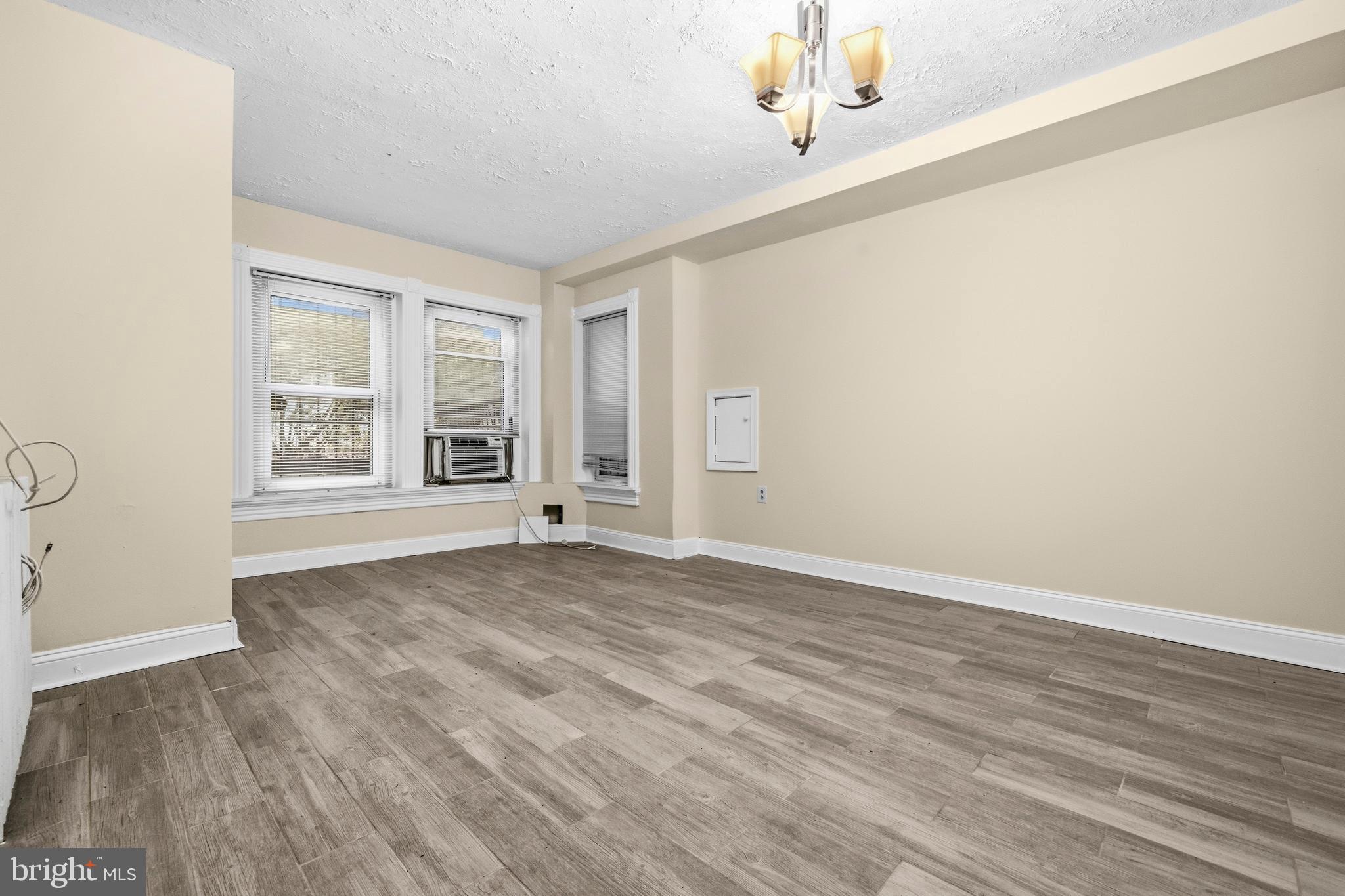 1920 11th Street Northwest Washington, DC 20001 - Photo 42 of 55 wooden floor in an empty room with a window