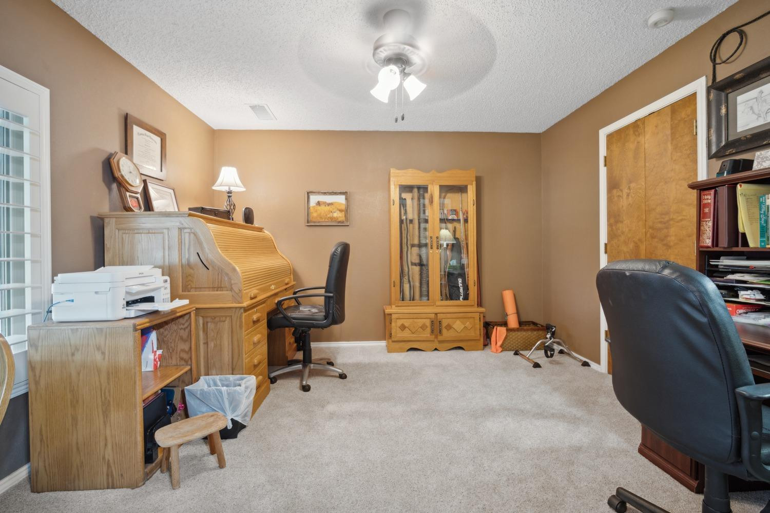 9002 Woodrow Road Wolfforth, TX 79382 - Photo 14 of 48 a view of a workspace with furniture and a window
