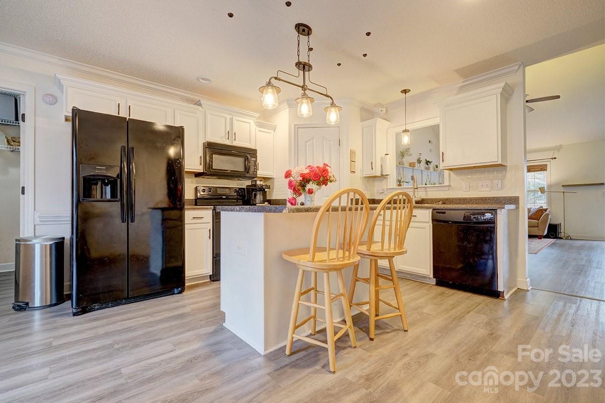276 Springlake Road, Unit 6 York, SC 29745 - Photo 11 of 31 a kitchen with stainless steel appliances granite countertop a refrigerator and a stove top oven