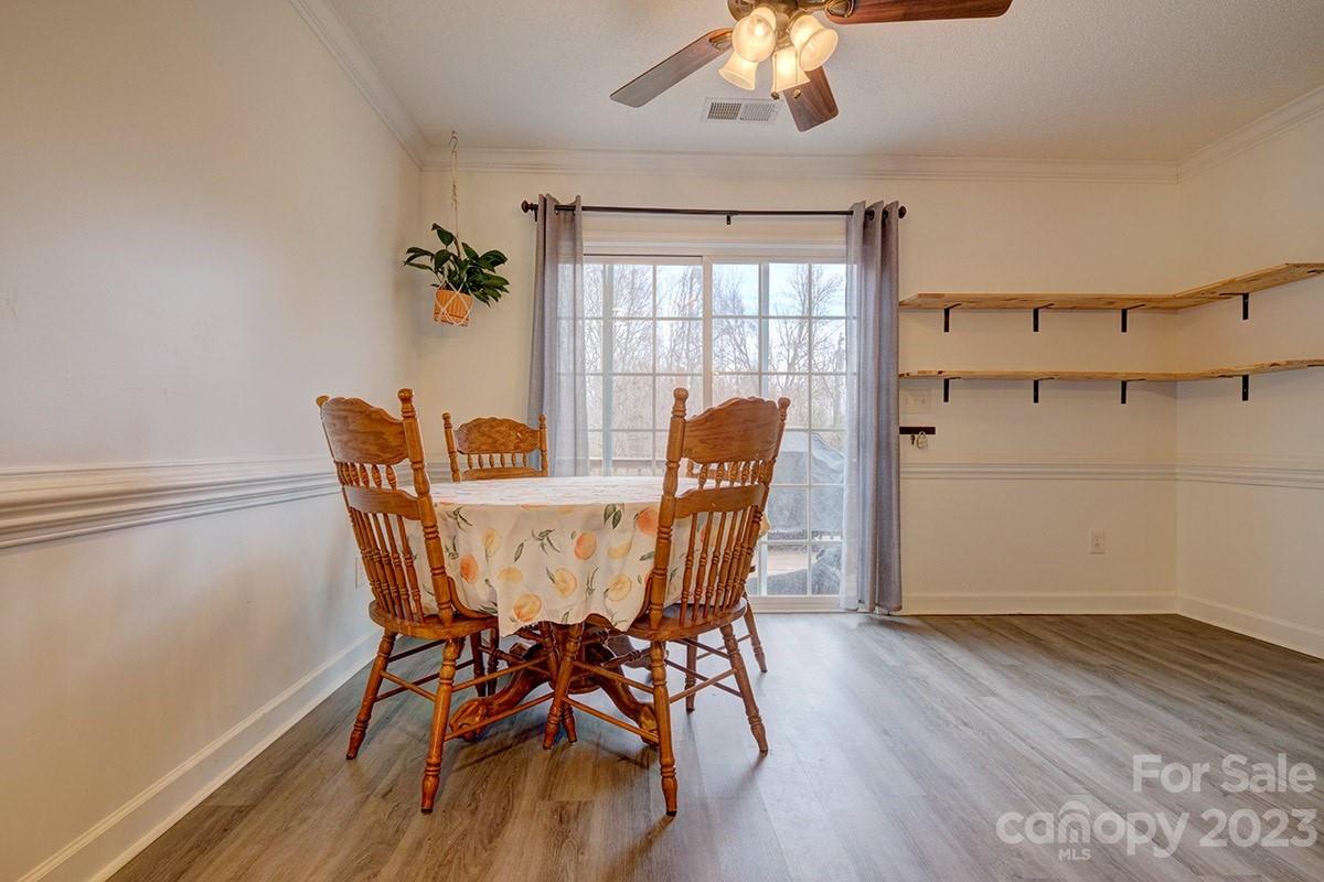 276 Springlake Road, Unit 6 York, SC 29745 - Photo 12 of 31 a view of a dining room with furniture window and wooden floor
