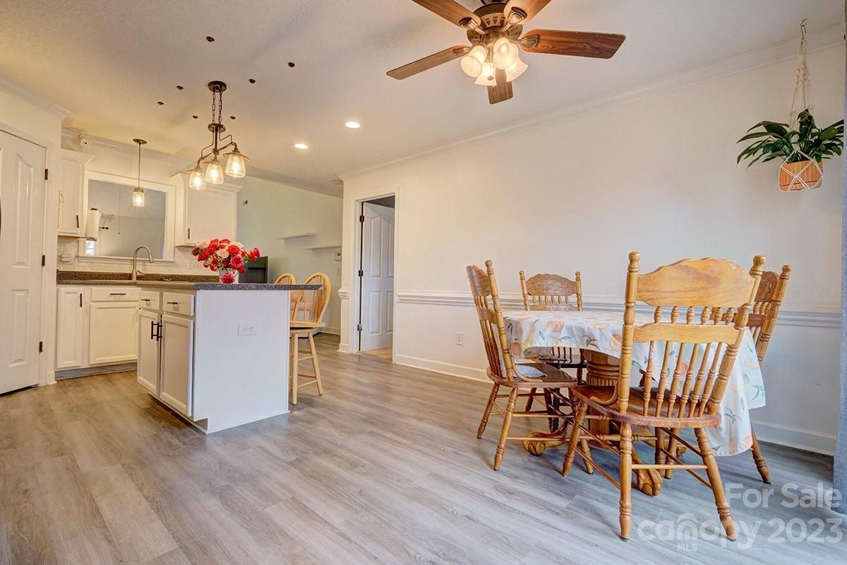 276 Springlake Road, Unit 6 York, SC 29745 - Photo 9 of 31 a dining room with furniture and wooden floor