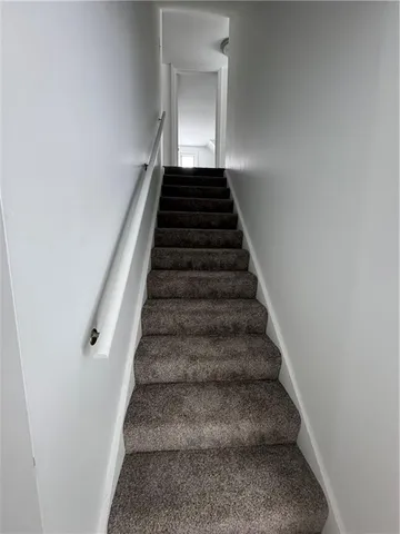 an empty room with a empty space and windows