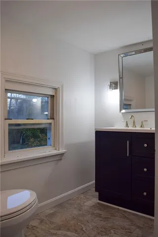 view of a house with a yard and garden