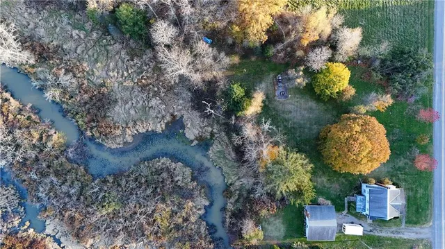 a aerial view of a house with lots of green space