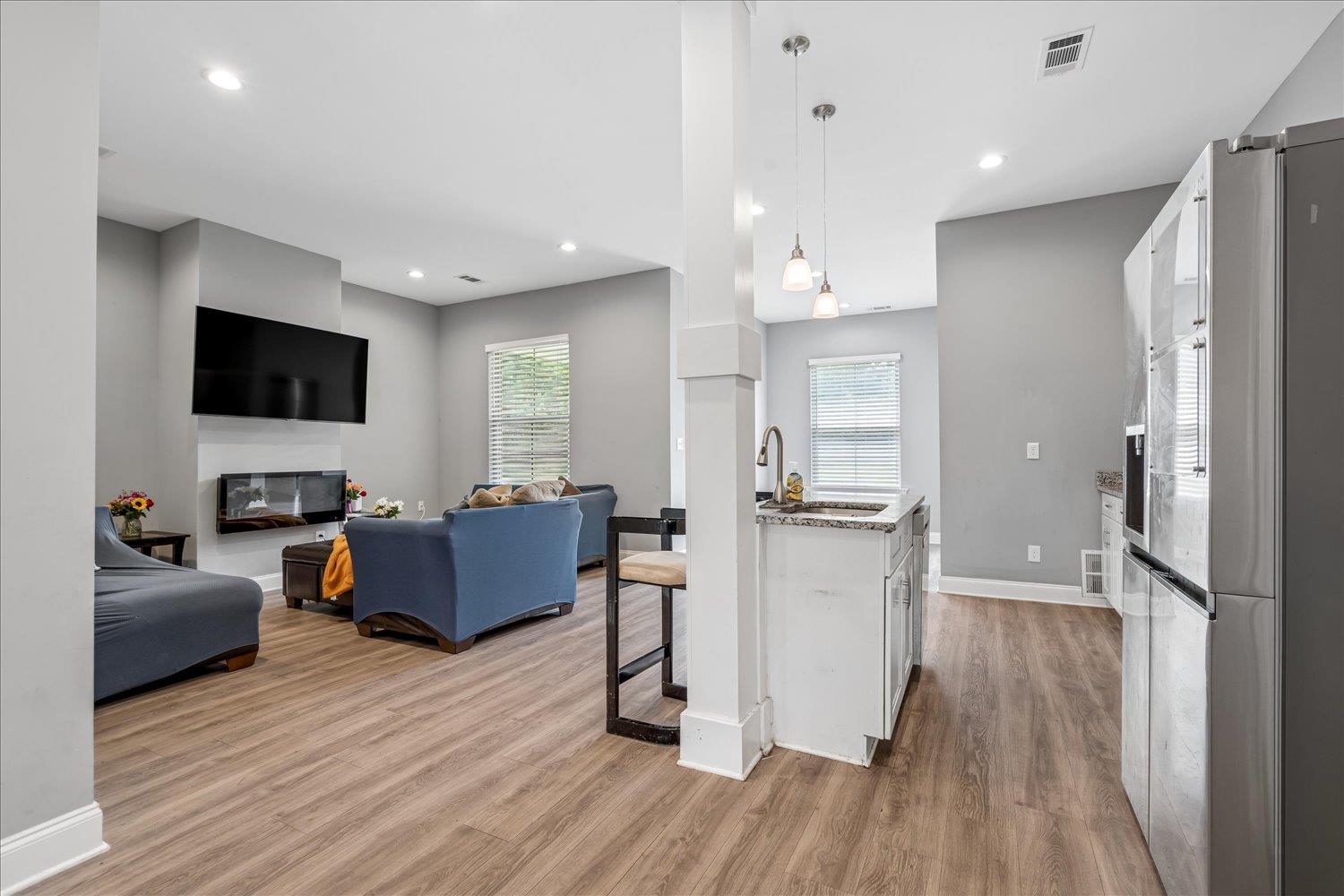 8867 Hampton Court Road East Memphis, TN 38016 - Photo 5 of 23 Open concept living area with wood-finish flooring