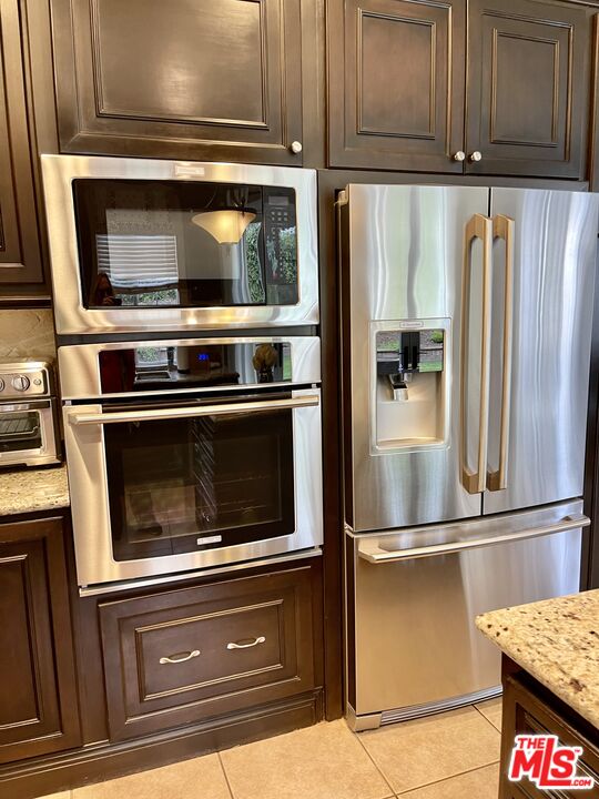 152 Park Hill Road Simi Valley, CA 93065 - Photo 13 of 16 a kitchen with granite countertop stainless steel appliances and cabinets