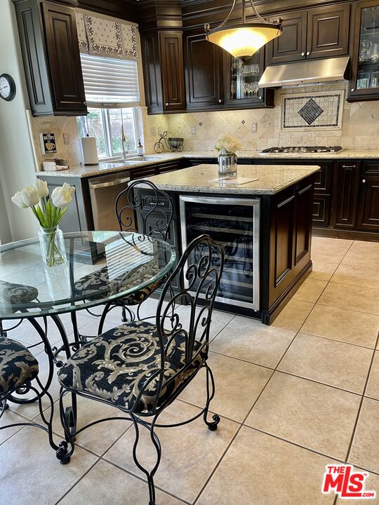 152 Park Hill Road Simi Valley, CA 93065 - Photo 16 of 16 a kitchen with stainless steel appliances granite countertop a stove a sink and a microwave