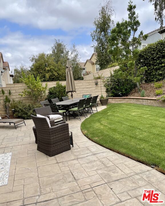 152 Park Hill Road Simi Valley, CA 93065 - Photo 4 of 16 a view of a patio with couches and table and chairs with wooden fence