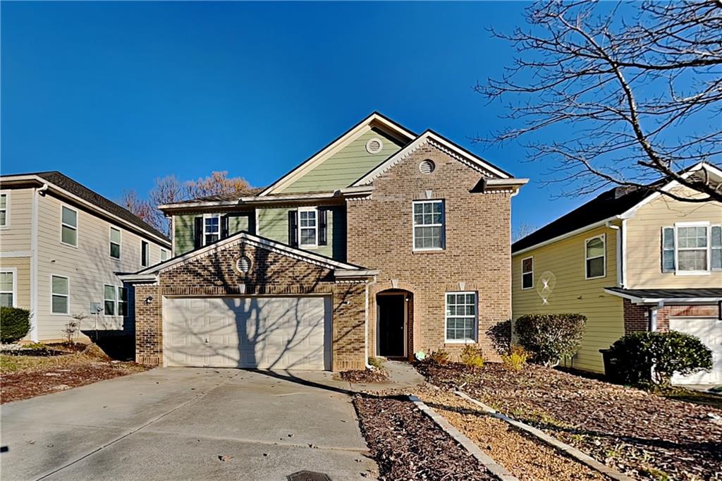 40 Parkmont Court Dallas, GA 30132 - Photo 1 of 19 a front view of a house with plants