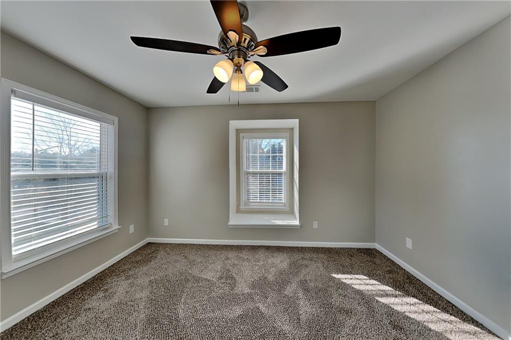 40 Parkmont Court Dallas, GA 30132 - Photo 13 of 19 a view of a livingroom with a ceiling fan and window