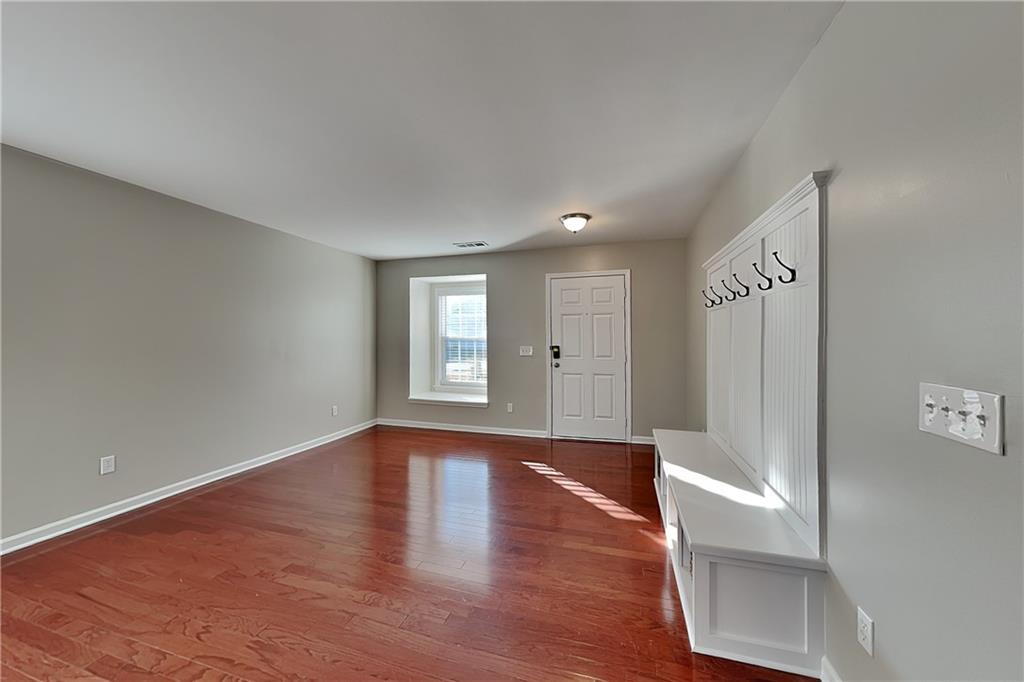 40 Parkmont Court Dallas, GA 30132 - Photo 3 of 19 a view of an empty room with window and wooden floor