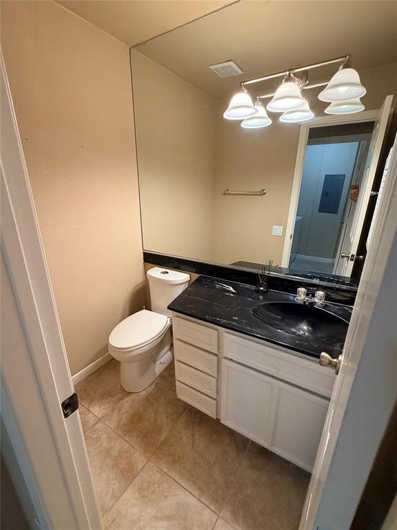 2051 Embassy Way Carrollton, TX 75006 - Photo 11 of 20 Bathroom featuring vanity and light tile patterned floors