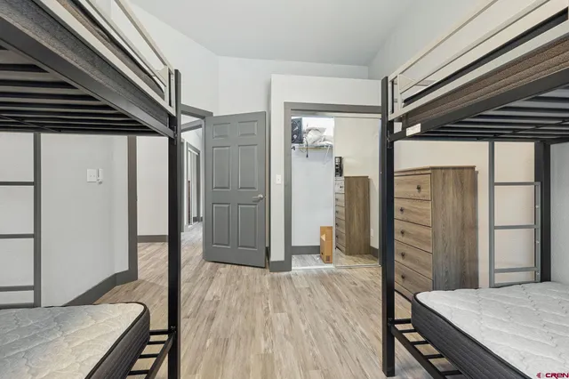 a bedroom with a bed and a television