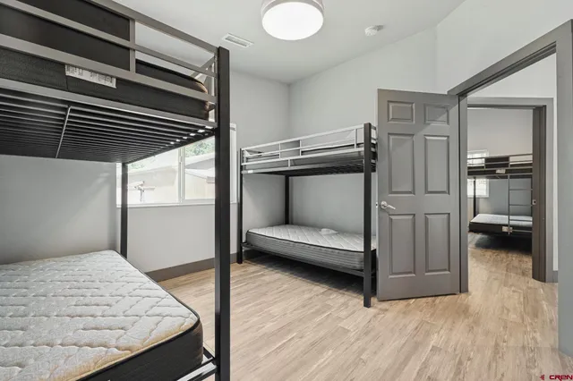 a view of a yard with large trees