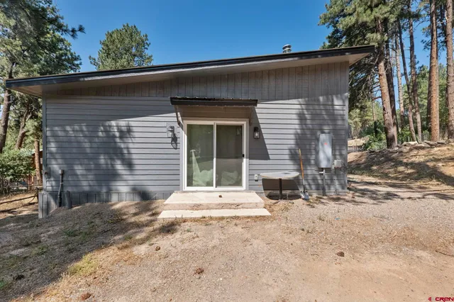 a view of a city with lush green forest