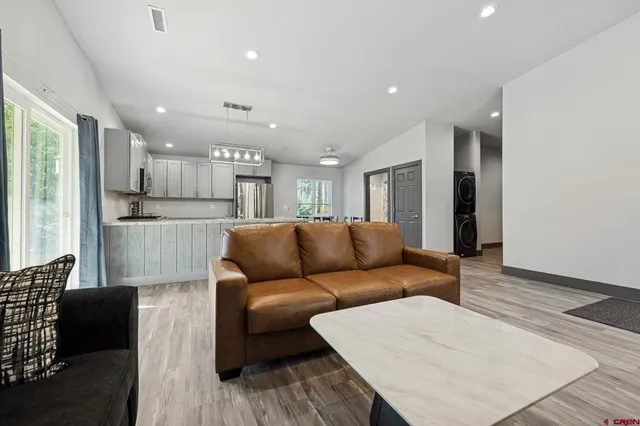 a living room with furniture window and fireplace
