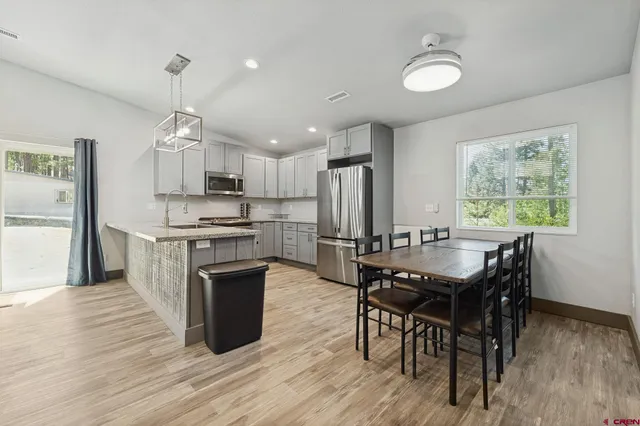 a kitchen with a stove and a sink
