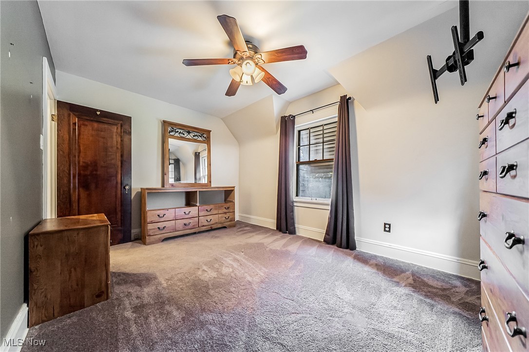 11703 Granger Road Cleveland, OH 44125 - Photo 35 of 41 Unfurnished bedroom with carpet and a ceiling fan