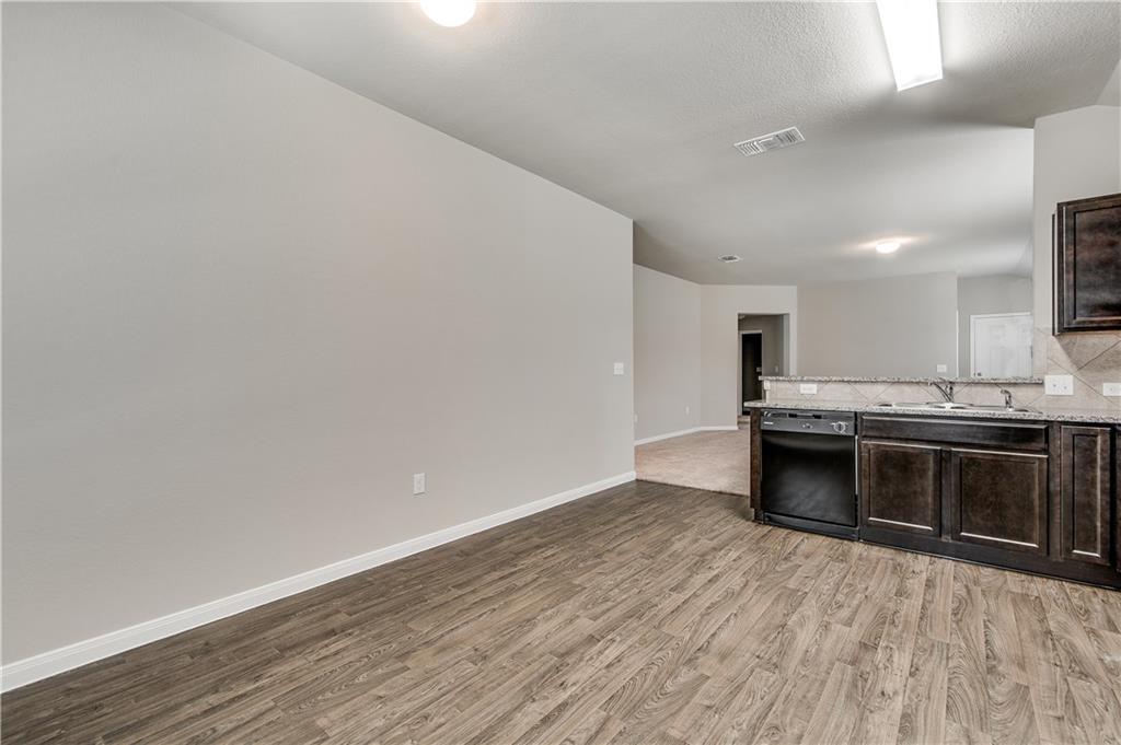 185 Voss Kyle, TX 78640 - Photo 21 of 26 a kitchen with stainless steel appliances a stove top oven and cabinets