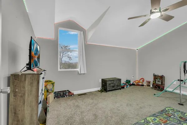 a view of a workspace with furniture and a closet